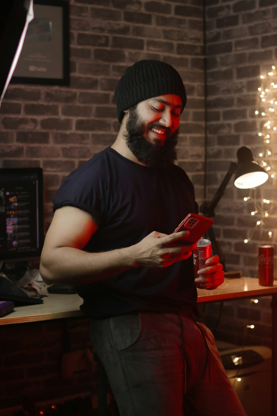 Portrait of a video editor smiling at his desk