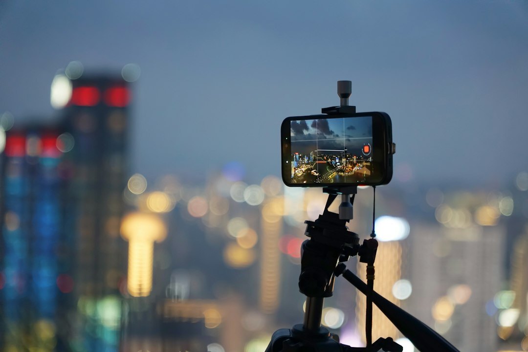 night cityscape with smartphone